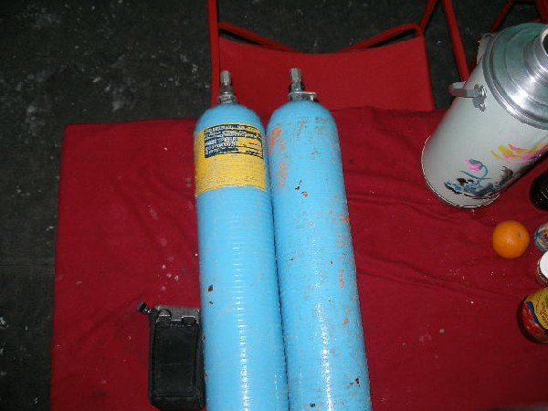 Image: 2, 4 litre oxygen bottles.