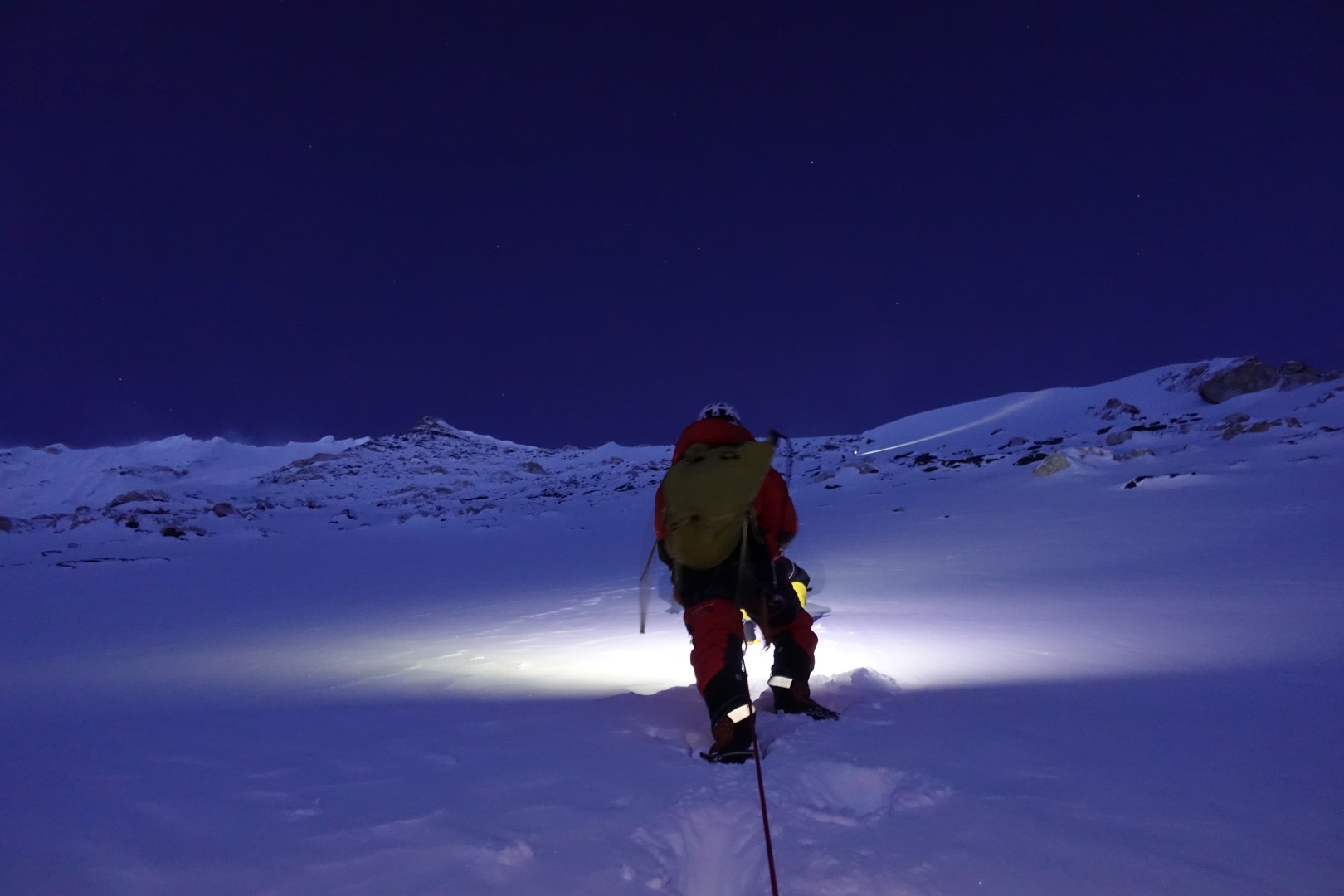 Climber on Nuptse at night