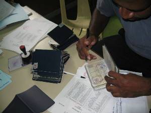 Image: The PNG Customs Officers came on board to process a pile of passports for everyone on PRIMROSE.