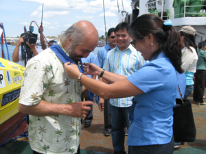 Image: On the deck of PRIMROSE, I was offered a welcome ribbon with the official seal of GenSan.